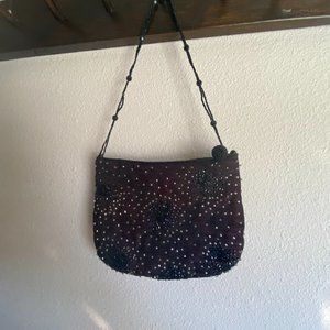 Small formal beaded black clutch with shoulder strap. Designer is Franchi.